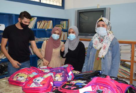 photo of  youth volunteers during the distribution of school bags to schools in Jordan Valleys 