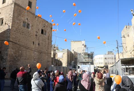 ActionAid Palestine(AAP) in Gaza and West Bank opened the activities of the joint 16 days campaign for combating Gender Based Violence (GBV) with releasing orange balloons by women targeted through the programs and projects of AAP at Abu-Alreesh checkpoin