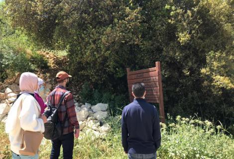 Photo of members of youth local council of Halhoul municipality while they are working on an environmental initiative aiming to maintain and rehabilitate the environmental walk of Haska Al-Safa in Hebron Governorate in the south of West Bank -copy Rights for ActionAid Palestine 2021