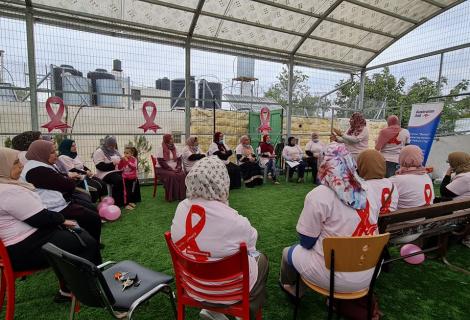 Photo of a group of women during their participation in raising awareness activities on importance of early diagnosis of   breast cancer in Tel Rumeida in the old city of Hebron    in Hebron Governorate within the activities of  October pink -West Bank -Palestine -copy Rights for ActionAid Palestine 2021 