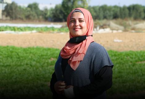 Photo of Palestinian young woman , Aseel Al-Najjar in her agricultural project in Gaza strip – Palestine 