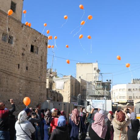 ActionAid Palestine(AAP) in Gaza and West Bank  opened the activities of the joint 16 days campaign for combating Gender Based Violence (GBV) with releasing orange balloons by women targeted through the programs and projects of  AAP at Abu-Alreesh checkpoin