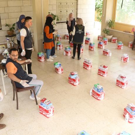 A number of volunteers from  Sharek center/Hebron are preparing hygiene kits to be distributed on the needy families in H2 under AAP’s Preparedness and Response plan to COVID-19 