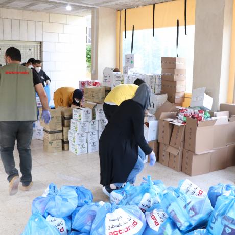Members of youth groups and staff members of ActionAid Palestine participate in packing and preparing hygiene kits supported by AAP to distributed to the infected families by corona virus in the marginalized villages in Bethlehem and Hebron in the south of West Bank 