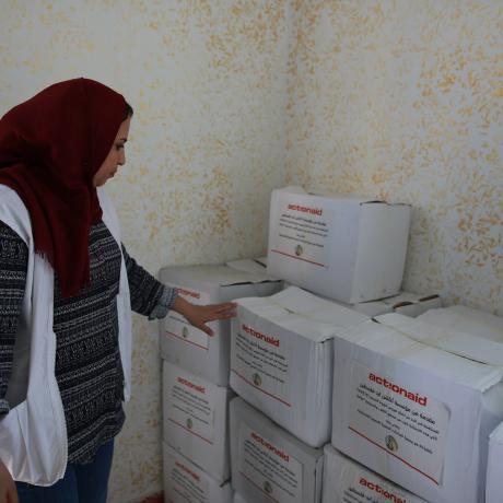 photo of young woman volunteers from the Palestinian Developmental Women Studies Association (PDWSA)  which is AAP’s partner during distribution of food parcels in Gaza strip within emergency intervention AAP implemented to respond to COVID-19