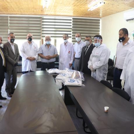 (This photo is photo  of Hebron Government Hospital (Princess Alia) in Hebron Governorate. It includes representatives of AAP, Hebron Governorate, Palestinian ministry of Health, civil and health organizations during delivery of personal protective equipment and medical masks provided by AAP to respond to the needs of health workers in the department of emergency in the hospital)  