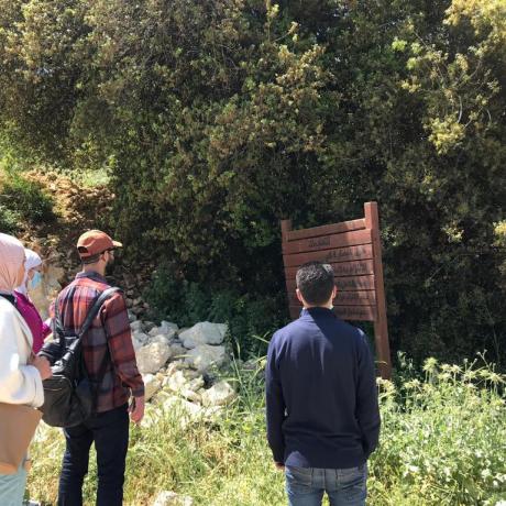 Photo of members of youth local council of Halhoul municipality while they are working on an  environmental initiative aiming to maintain and rehabilitate the environmental walk of Haska Al-Safa in Hebron Governorate in the south of West Bank -copy Rights for ActionAid Palestine 2021 