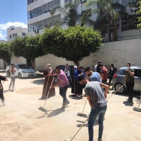 Photo of young people during their participation in national campaign  titled with “ We will Rebuild it’ for  cleaning Gaza from rubbles after end Israeli war against Gaza -Gaza Strip- Palestine -2021