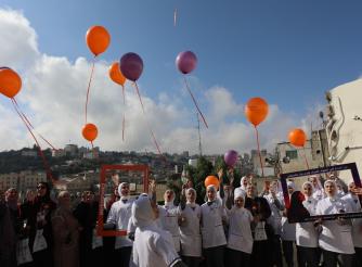 A photo of the 16 Days of Activism campaign activity against gender-based violence with women in the Old City of Hebron, 2025 Hebron – Southern West Bank –