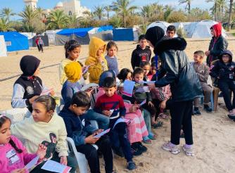 A photo from one of the activities of the youth initiative “ Safety is Gain” in the Gaza Strip, which seeks to engage Palestinian youth in early recovery plans by implementing awareness initiatives on the prevention of explosive ordnance  and remnants of war.